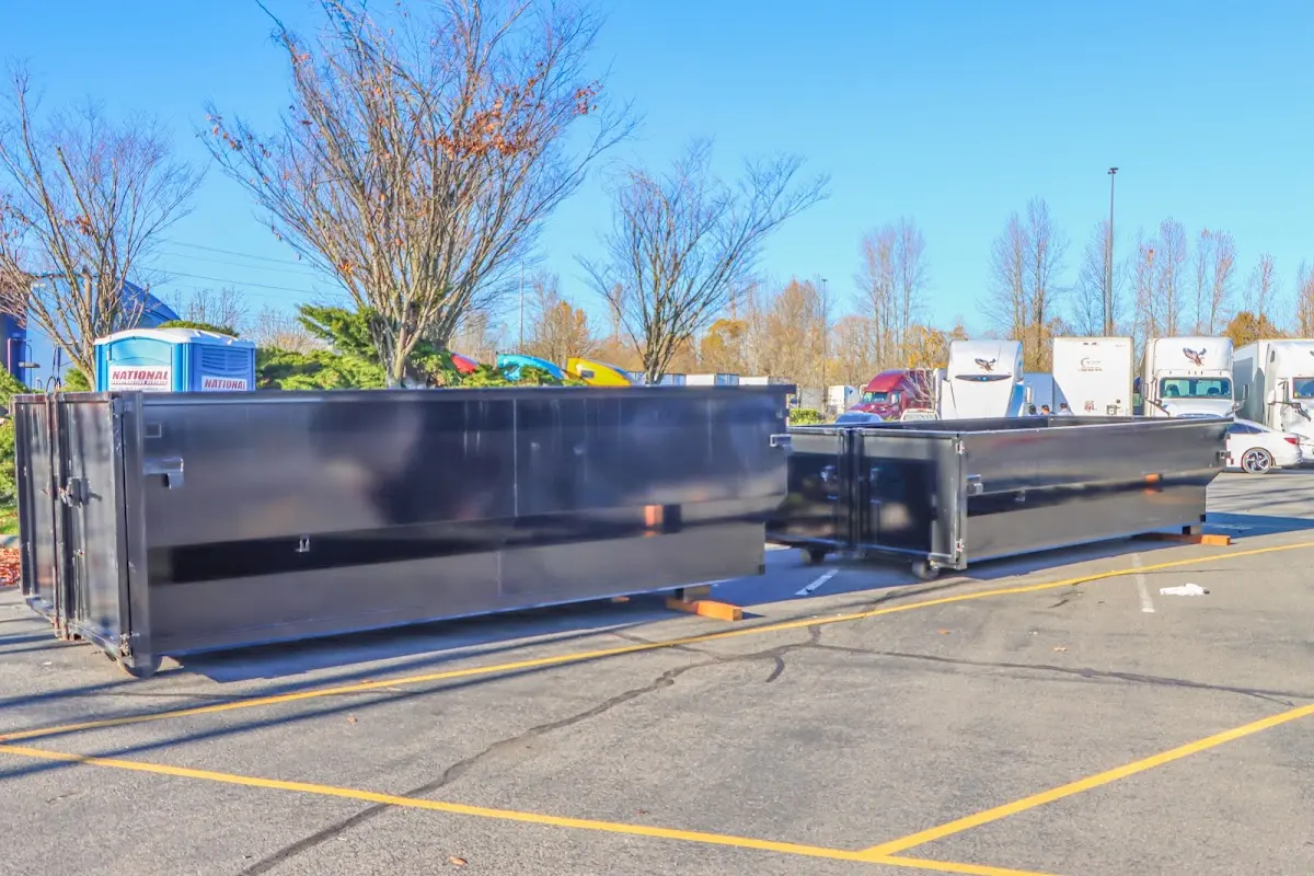 Professional dumpster rental service with roll-off container on residential driveway in Shawangunk